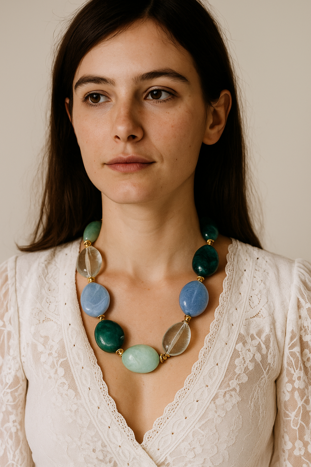 Dramatic emerald-green chunky necklace with vintage-inspired design and bohemian flair.